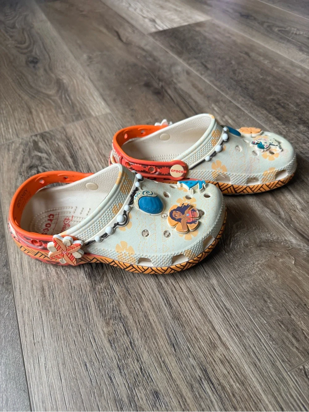 Disney Moana CROCS Kids Beige Clogs with Bright Orange Trim and Colorful Charms